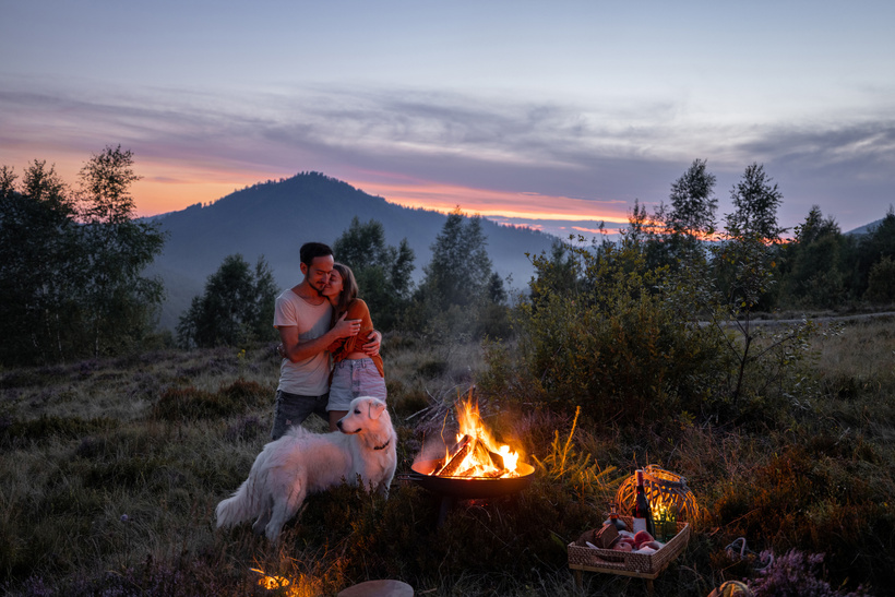 Couple with Dog Camping on the Mountains